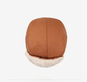 Overhead view showing brown winter trapper hat with warm faux fur lining and ear flaps