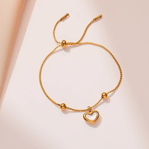 Adjustable gold rope chain bracelet with hollow heart pendant and polished metal beads