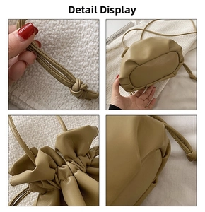 Detailansicht der khakifarbenen Beuteltasche mit Kordelzug und strukturierter Lederoptik