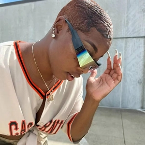 Y2K futuristic rimless sunglasses with oversized iridescent lenses and wide black temples