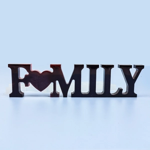 Detail view of a 'FAMILY' resin letter sign with heart motif in dark gradient finish