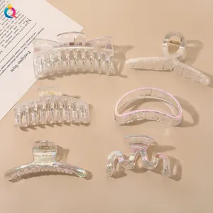 Detailed set of six iridescent translucent hair clips with various geometric patterns