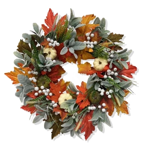 Autumn wreath with white pumpkins, maple leaves and berries for Thanksgiving harvest decor