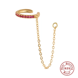 Macro view of gold 925 silver ear cuff with pink gemstone and delicate link chain