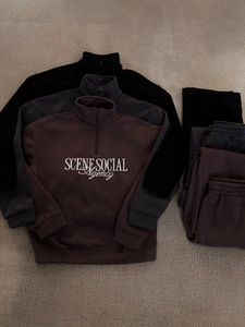 Three colors of half-zip sweatshirt and pant sets in black, dark grey, and coffee brown