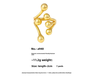 Macro shot of 18K gold plated stainless steel ring with creative ball branch design