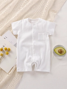 Short sleeve baby romper in white ribbed cotton fabric with front pocket and snap closure