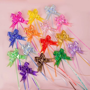 Flat lay of 14 colorful organza pull bows with gold stripes for gift wrapping decoration