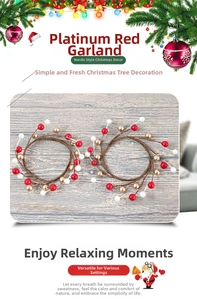 Detail of two Christmas berry candle rings with red, gold and white berries decoration