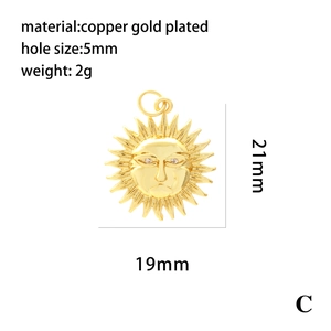 Macro shot of 21mm copper gold plated sun pendant with 5mm hole for DIY jewelry making