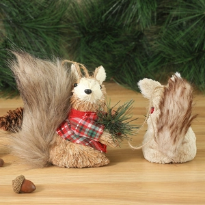 Straw squirrel Christmas ornaments set on pine background for holiday home decor