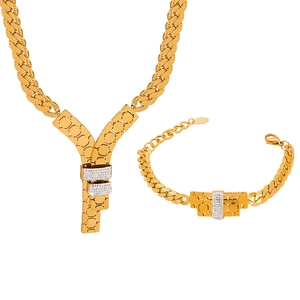 Elegant gold titanium steel jewelry set featuring a layered Y-pendant necklace and bracelet