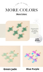 Close-up of glass cross pendants in green, light green, and purple with gold clasps