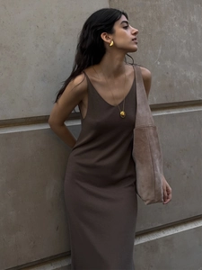 Detail of soft knit dark brown sleeveless dress with a minimalist V-neck cut