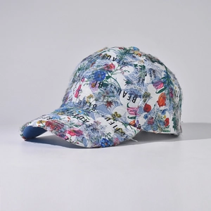 Close-up of distressed floral baseball cap with frayed edges and beauty embroidery