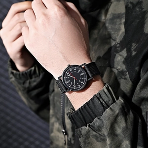 Tactical military quartz watch with black nylon strap and 24-hour dual-scale dial