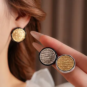 Fashionable round drip oil earrings with relief texture in gold and silver plating