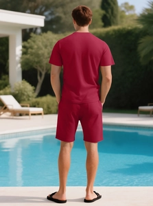 Rear view of dark red waffle texture men's short set in outdoor pool side setting