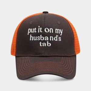 Brown and orange trucker hat with white embroidery 'put it on my husband's tab'