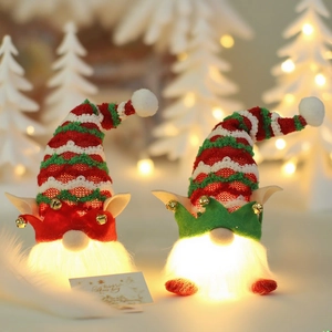 Luminous Christmas gnomes with striped hats and warm glowing LED beards decor