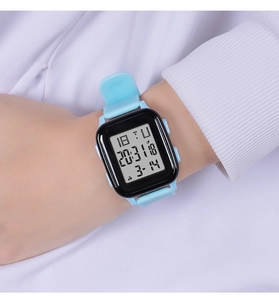 Close-up of a blue rectangular digital sports watch worn on a wrist for teenagers