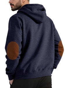 Detail view of the contrast brown elbow patches and knit texture on the navy blue hoodie