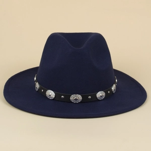 Close-up of navy blue wool fedora with black studded band and silver rivets detail
