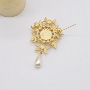 Detail view of the vintage baroque pearl brooch back showing pin clasp and gold metal work