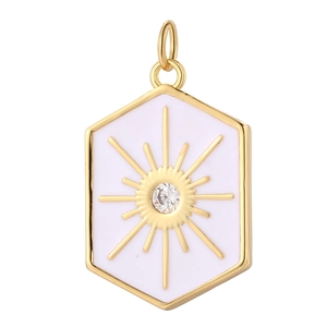 Detailed macro of golden hexagonal pendant with white enamel and sunburst zircon
