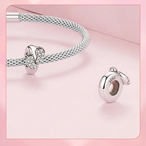 Close-up of S925 sterling silver baby footprint charm with fine pave zircon details