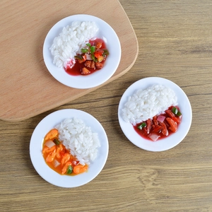 Detailed view of three realistic PVC miniature rice bowl models on a wooden surface