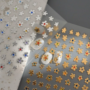 3D metallic flower nail art stickers with gold and silver bases and colorful rhinestones