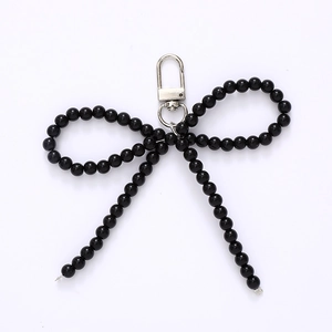 Elegant black beaded bow keychain with premium metal clasp for bags and phones