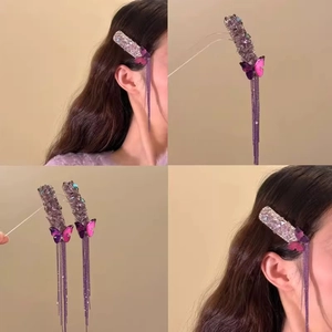 Elegant purple butterfly tassel hair clip with rhinestones and long fringe on model