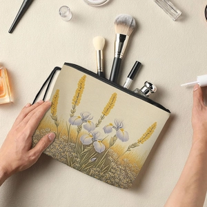 Floral makeup bag with purple iris patterns and zipper closure for cosmetics storage