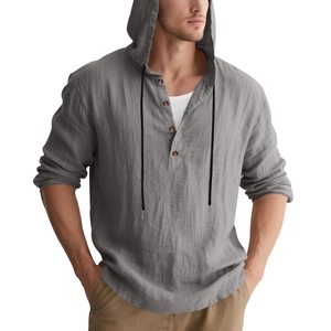 Detail of grey linen shirt hood and four-button placket with black drawstrings