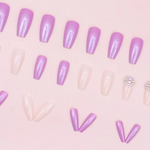 Long coffin aurora purple press-on nails with shimmering aurora finish and rhinestone accents