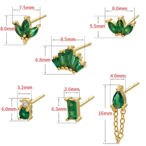 Set of gold geometric stud earrings with green and white zircons in various shapes
