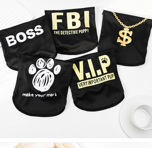 Flat lay of five black polyester pet bandanas with BOSS and FBI gold prints on white