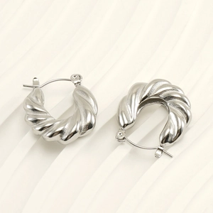 Modern twisted croissant U-shaped earrings in polished silver stainless steel metal
