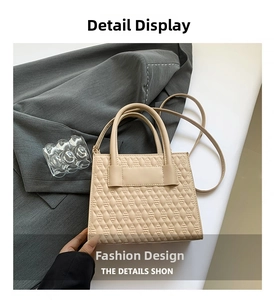 Detail of beige quilted faux leather handbag with textured diamond pattern and dual handles