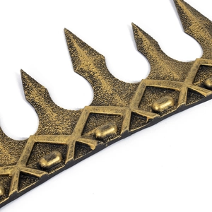 Detailed close-up of retro golden foam crown with textured spikes for cosplay and performance