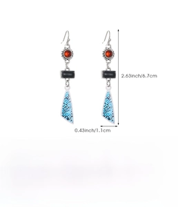 Detail showing Bohemian drop earrings dimensions 6.7cm by 1.1cm on white background
