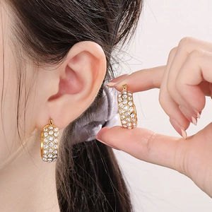 Minimalist gold hoop earrings with sparkling crystal inlay for a luxury women's look