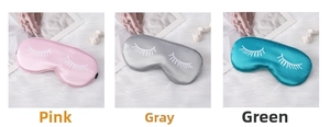 Detailed comparison of pink, grey and green silk sleep masks with eyelash prints