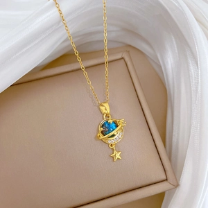 Elegant gold starry blue planet necklace with shimmering crystal halo and small star