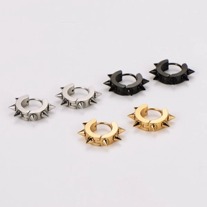 Three pairs of punk style spike hoop earrings in silver, black and gold finishes