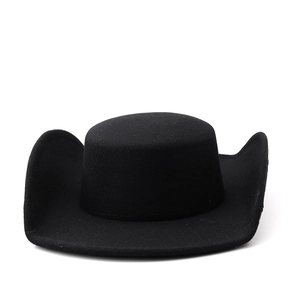 Detail of black felt boater hat with wide curved brim and flat crown for high fashion styling