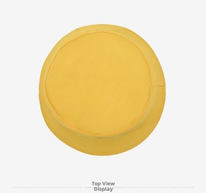 Top view of a bright yellow bucket hat with flat brim and rounded top on white background