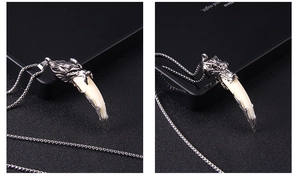 Close-up of vintage wolf head necklace with bone pendant and detailed stainless steel chain
